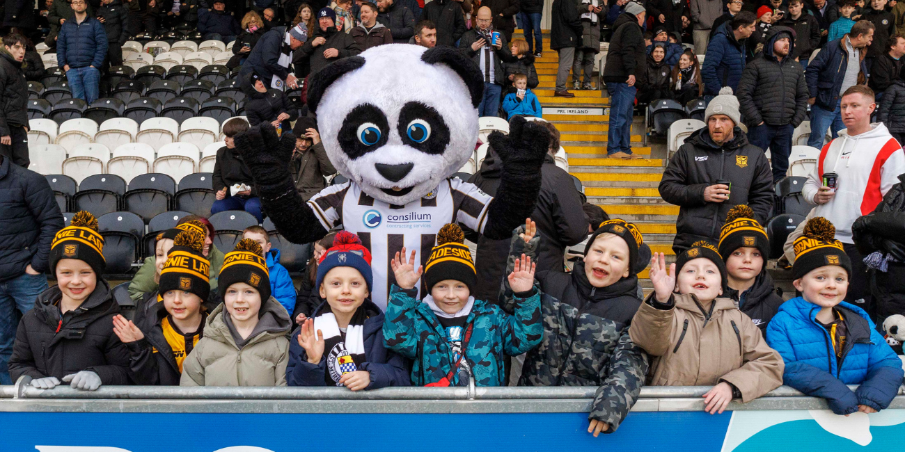 Paisley Panda with young supporters in the Family Stand