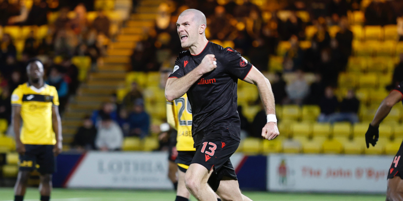 Alex Gogic celebrates late equaliser at Livingston