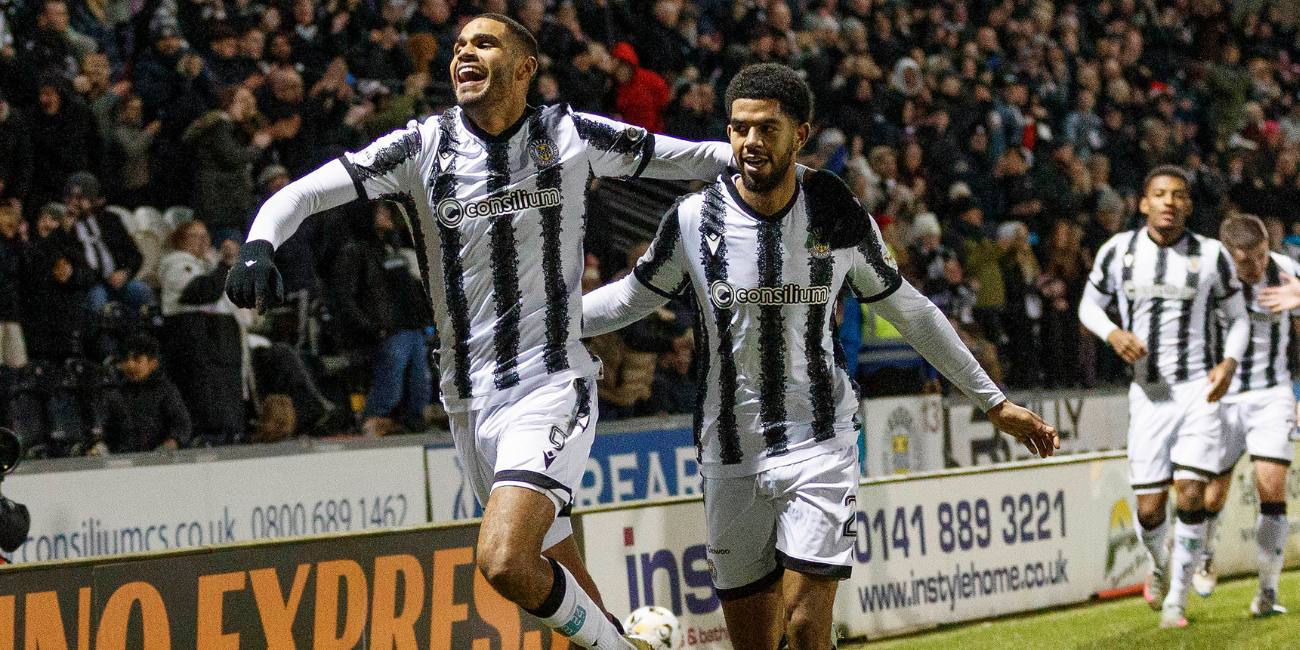 Mikael Mandron celebrates with Miguel Freckleton