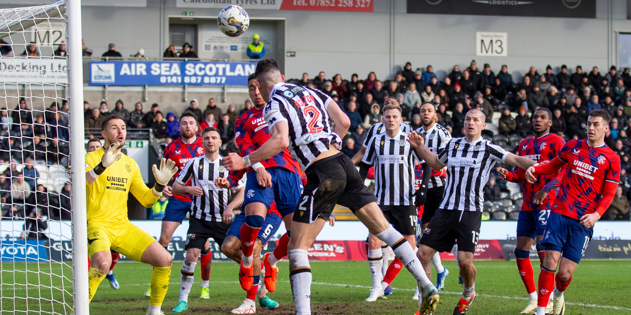 James Bolton heads off the bar against Rangers