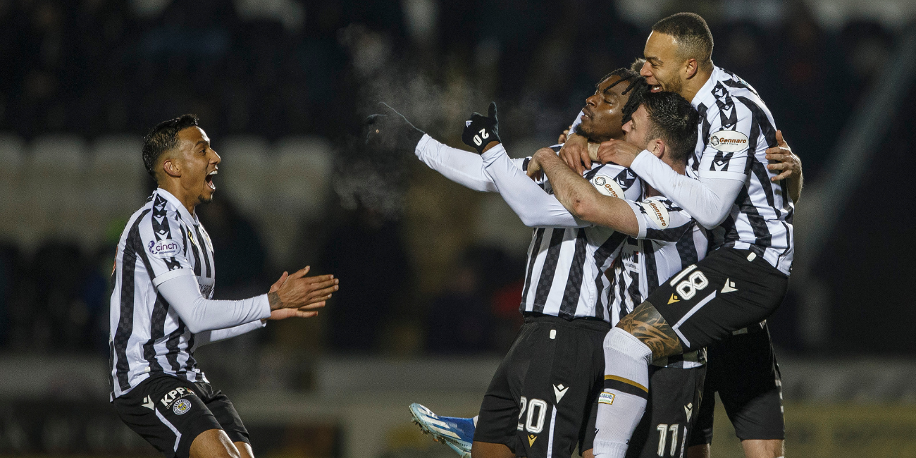 Toyosi Olusanya celebrates with teammates after his goal against Dundee